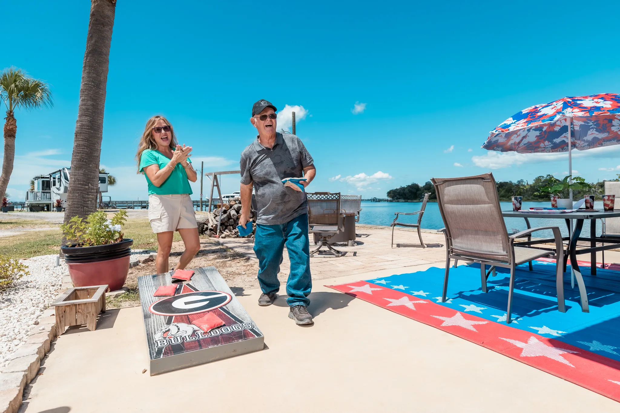 Guests playing cornhole at Nautical Point RV Park